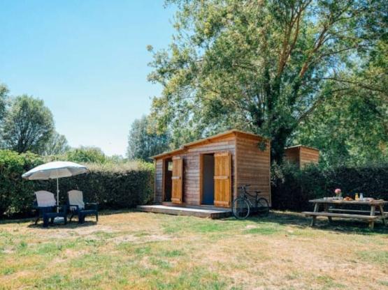 Premium pitch with private sanitary facilities and kitchenette!