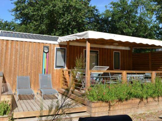 Mobilheim PREMIUM CLIM 28m² - 2 Zimmer + überdachte Terrasse + TV + Bettwäsche + Handtücher